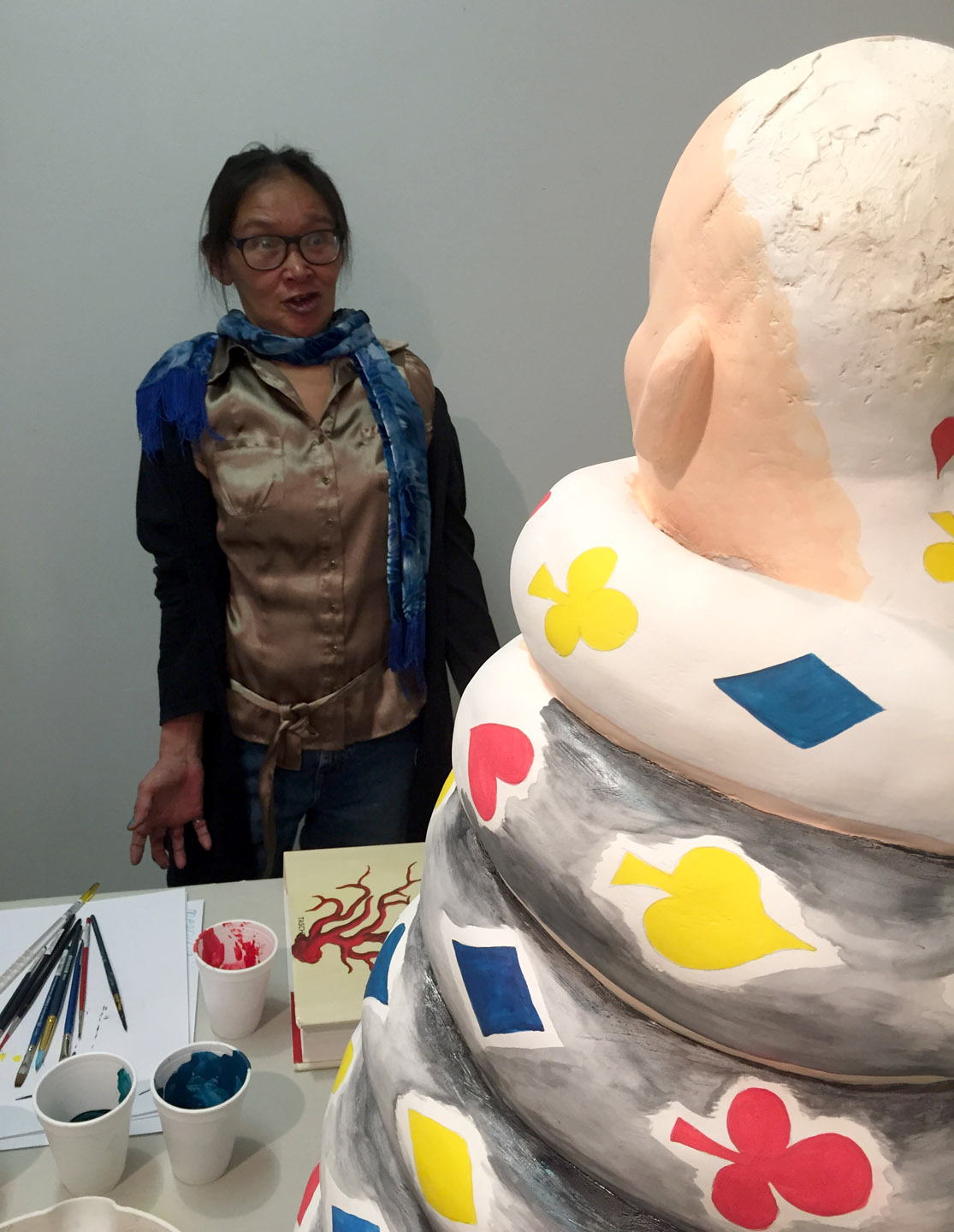 Shuvinai demonstrates what the sculpture's expression is, and how that makes her feel. Basement of Concordia, Montreal. November 13, 2015