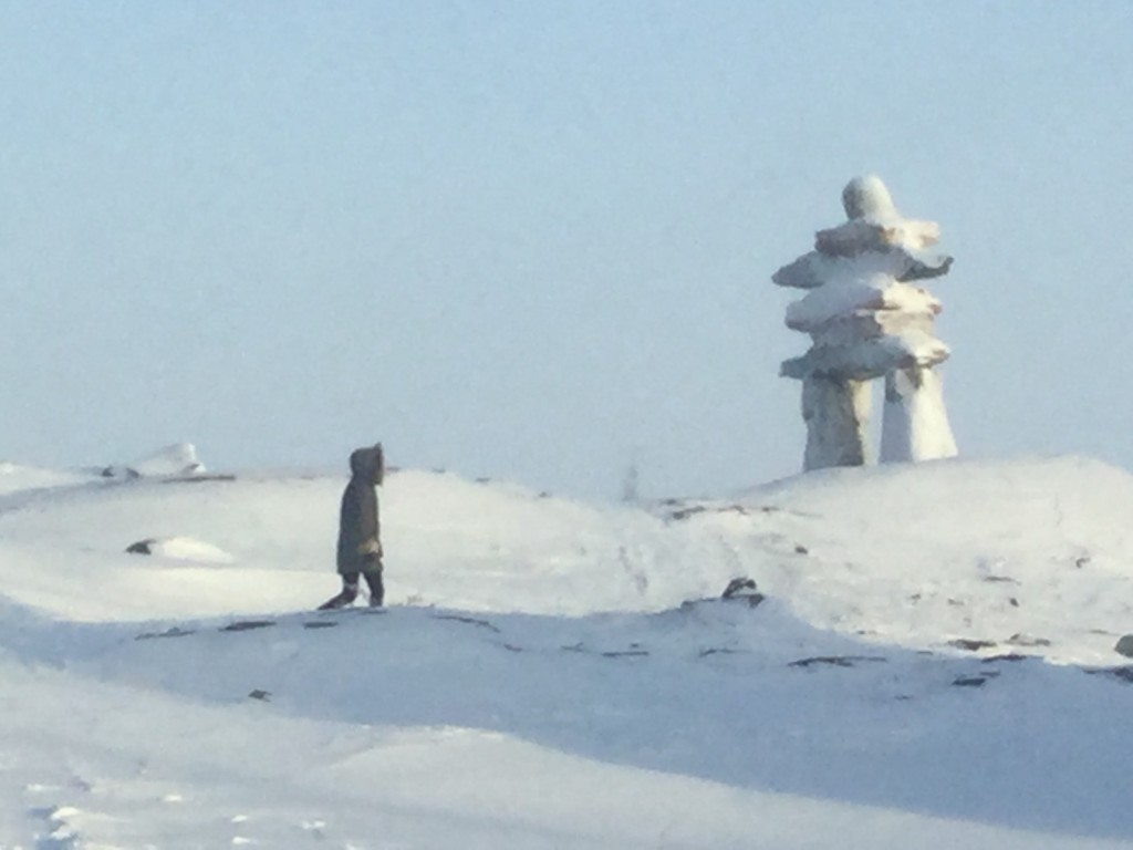 Walking over to the town Inuksuk, keeping watch above the village. 